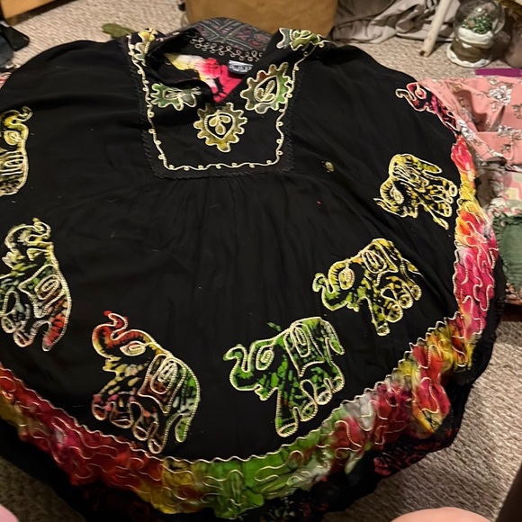 A black top with elephants, and then embroidery around the elephant and neckline - Picture 1 of 5